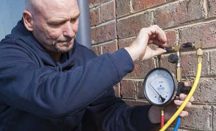 Plumber Testing Water Pressure